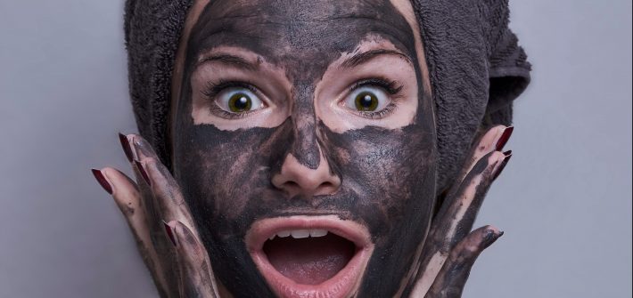 Woman with black face mask | exfoliating tips