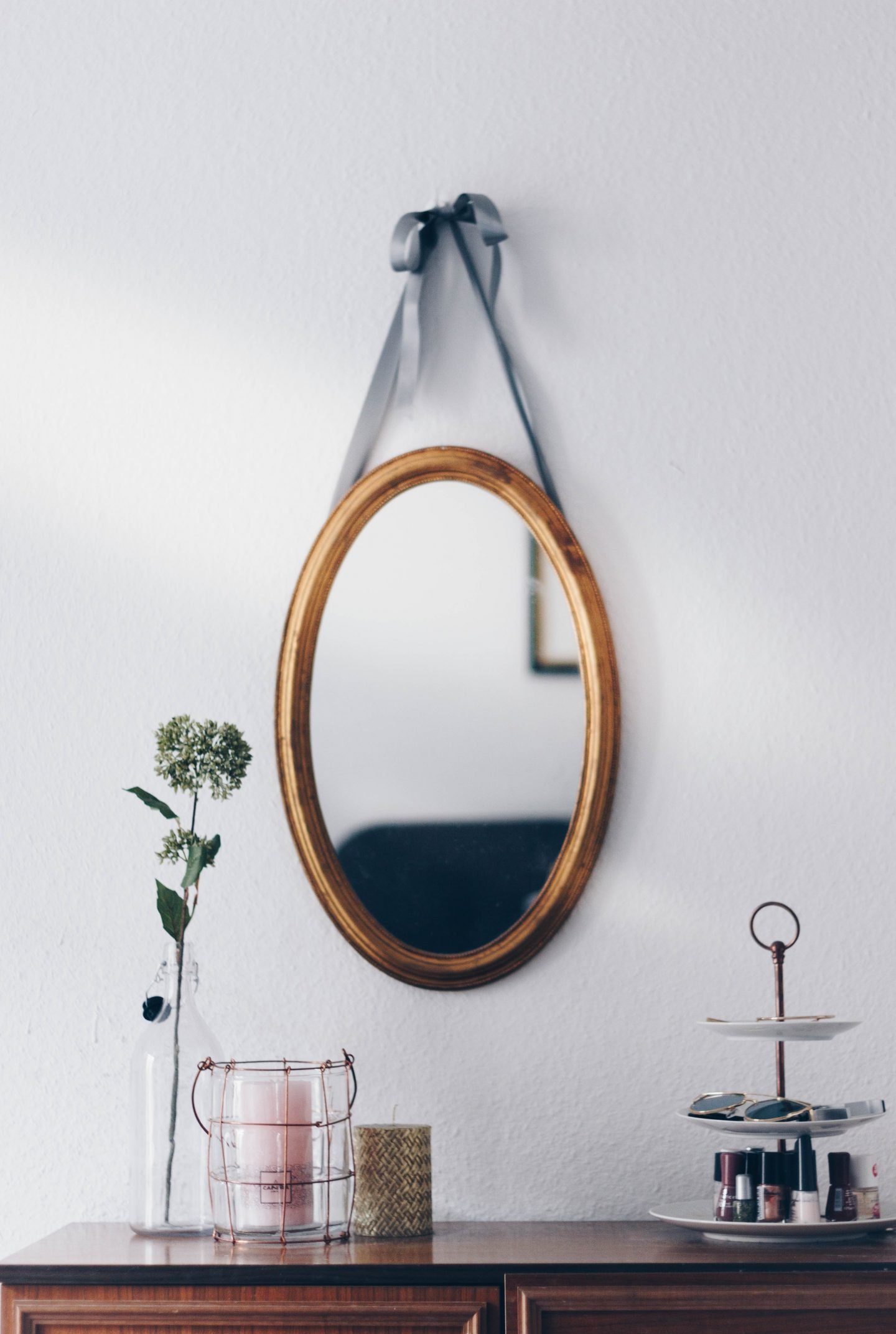 How To Organize Your Makeup and Skincare 12 Makeup table and a round hanging mirror