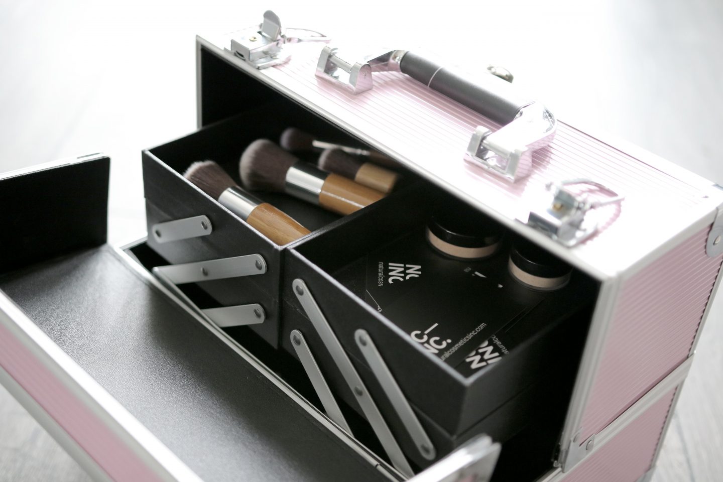 Professional makeup organization kit with makeup brushes and foundation