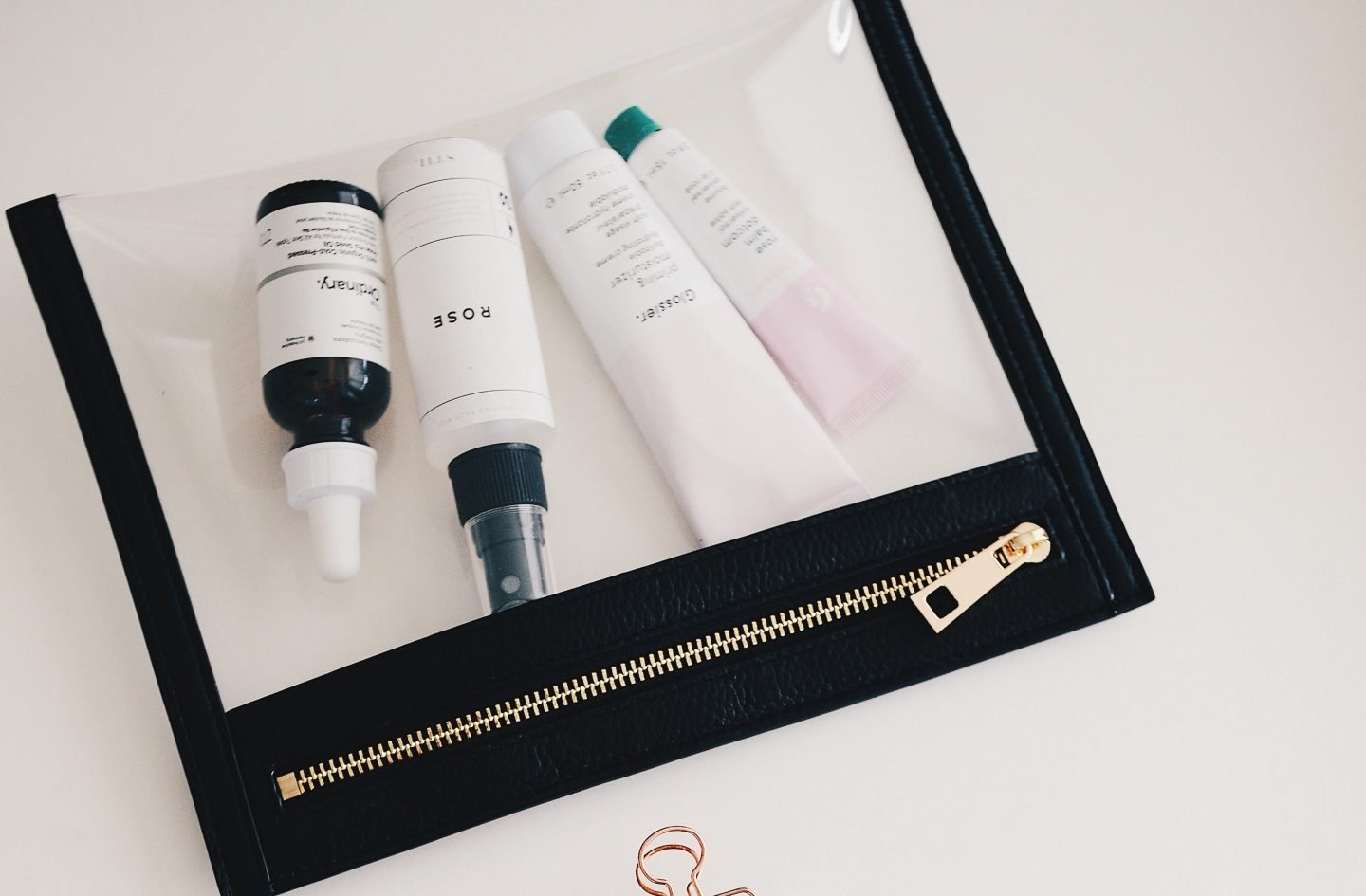 How To Organize Your Makeup and Skincare 7 Blank notepad and clear makeup bay with makeup and skincare inside it