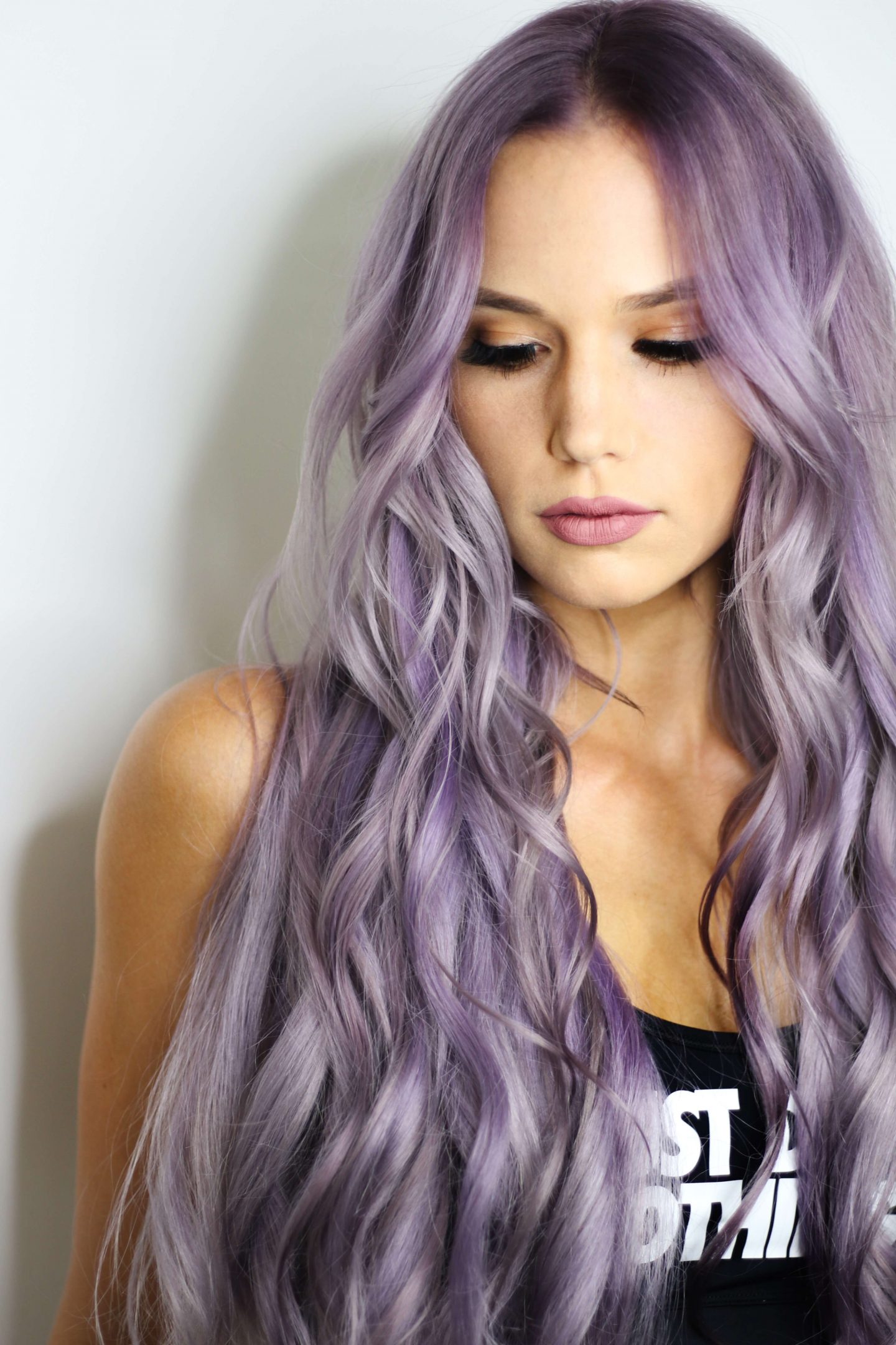 10 Simple and Easy Tips For Longlasting Lash Extensions 2 woman with long curly purple hair | longlasting lash extensions